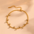 Detailed close-up of gold stainless steel anklet featuring sparkling zircon charms - Gold Diamond-encrusted Bracelet O602