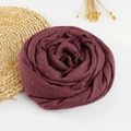 Soft burgundy cotton linen scarf with frayed edges displayed in a stylish circular roll - 190x100cm / Dark Purple