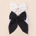 Set of two solid color bow hair clips in black and white jacquard fabric with long ribbons - Combination 4 (Black/White Relief Jacquard Set)