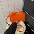 Fashionable bright orange suitcase-style crossbody bag with dual zippers and handle - Orange