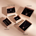 Pink and cream jewelry boxes with black velvet inserts and size specifications - Size 1 5*5*3cm / White & Pink