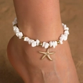 Beaded starfish anklet with white stones and gold beads on beach background - White Stone Gold Starfish Style
