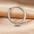 Macro detail of a 15mm silver huggie hoop earring on champagne satin fabric background - 1PC / 15mm / Silver