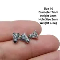 Macro view of 7mm antique silver bead spacers showing detailed relief and size scale - Style 10