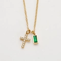 Detail of gold-plated cross necklace with emerald green gemstone and white zircon stones - May/Green