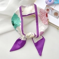Elegant floral green twilly scarf with purple borders shown in a stylish knotted display - Lotus Purple