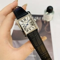 Detail of silver rectangular watch with white Roman dial and black leather strap - Silver Case Black Leather