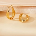 316L stainless steel gold intertwined triple hoop earrings on a warm stone background - 25mm / Gold