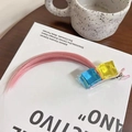 Cosplay hair clip featuring pink wig strands with blue and yellow cube ornaments - Ice Cube Light Pink