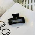 Glossy black rectangular hair claw clip placed on a stylish magazine background - Glossy Black