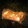 Luminous Halloween witch broom LED fairy lights with warm yellow glow in festive setting - Warm Light String Lights