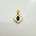 Macro view of a 18K gold plated square pendant with green gemstone and natural white shell - Square