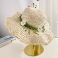 Beige straw sun hat with daisy flower ring and fringe brim on a gold stand - Beige Daisy Frayed Edge