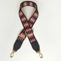 Detail of red diamond woven wide bag strap with black leather ends and gold metal hooks - Red Diamond Black Leather Gold Hook