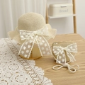 Detail of child straw sun hat and matching mini bag with lace bow and heart patterns - 52cm 3-6 Years / Set - Beige