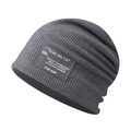 Detail view of a grey ribbed slouchy beanie featuring a black lettered fabric patch. - Adjustable / Dark Gray Fine Grid