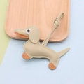 Cute leather dachshund bag charm in khaki and orange with fine stitching and lanyard - Dachshund / Matcha Green