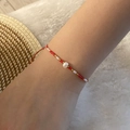 Handmade red rope bracelet with white pearl and micro beads on a soft white background - 2# Red