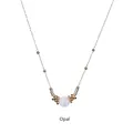 Detail view of gold stainless steel necklace featuring a round white opal stone pendant - White Opal-Gold Chain