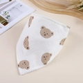 Detail of white cotton muslin baby bandana bib with cute brown bear prints and soft texture - Bear