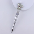 Detail of silver beaded pen featuring a grey silicone koala charm and colorful accents - Grey Koala