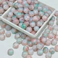 Macro shot of 10mm pink and green marbled glass beads for DIY jewelry making - Fendai (10mm Protein Jade)