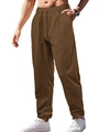 Detail of dark brown trousers featuring drawstring waist and decorative center seams - Camel