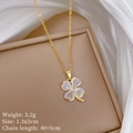 Close-up of golden clover necklace featuring translucent white cat eye stone on box - Four Leaf Clover (F521 Gold) / Gold