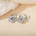 Polished silver titanium petal flower hoop earrings on elegant beige background - Plum Blossom Pendant / Steel