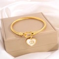 Gold rope twisted steel bracelet with heart charm featuring a cursive letter D detail - Letter D