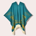 Detail of teal and yellow western poncho featuring cream tassel fringe and knit texture - 130x150cm / Pullover Colorful Bird Blue