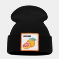 Macro detail of the orange fruit embroidery patch on a black ribbed knit beanie hat - Orange Pattern