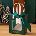 Detail of dark green gift bag with transparent window, ribbon bow, and gold lettering - Small (14.5x8x16.5cm) / Dark Green + Thank You Tag