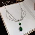 Detailed view of emerald gemstone multilayer necklace inside a beige jewelry box - Emerald Multi-layer Diamond Style (44#) / Silver-Green