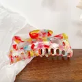 Large acetate hair claw clip featuring a colorful marble pattern with blue and red tones - 13cm / Tropical Red 13CM