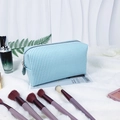 Light blue seersucker makeup bag with white stripes and round zipper pull charm - Lake Blue