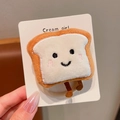 Coletero de peluche con forma de tostada en color marrón y beige con bordado de sonrisa - Pan tostado