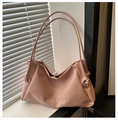 Detail of soft nude pink leather tote bag featuring magnetic clasp and side knot decor - Pink