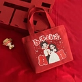 Bolsa de regalo de boda roja en lona con dibujo de novios y signo de Doble Felicidad - Armonía Centenaria