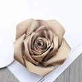 Close-up of champagne gold satin rose brooch with realistic layered fabric petals - Champagne