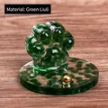 Cat paw resin ornament made of green glass stone with decorative gold metal bead - Green Glass