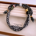Ethnic style fabric necklace with leopard print and multicolored beads on velvet tray - Black and White Leopard Print With Colored Beads