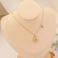 Detail of gold evil eye necklace with teardrop pendant on velvet jewelry display - 5# Necklace-Water Drop Main Pendant