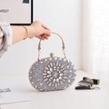 Elegant silver rhinestone clutch bag with floral patterns and a gold metal handle - Silver
