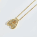 Detail of gold twisted chain with a puffy letter A pendant set in sparkling rhinestones - Letter A