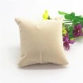 Macro shot of a beige fabric jewelry display pillow with decorative faux flowers - Apricot Common Velvet 9x9.5