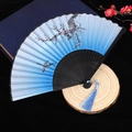 Blue and white gradient folding fan with black plum blossoms and blue tassel - Size 50