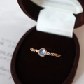 Vintage 14K gold ring featuring a blue moonstone center and floral leaf carvings - Gold Moonstone Leaf Engraved Ring
