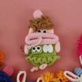 Handmade crochet sausage mouth doll key case in green dress and pink skin tone - Girl in Green Dress