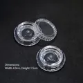 3g transparent plastic nail art storage container with screw lid on black background - Transparent Flower Shaped Flat Bottle (4.3*1.5cm)